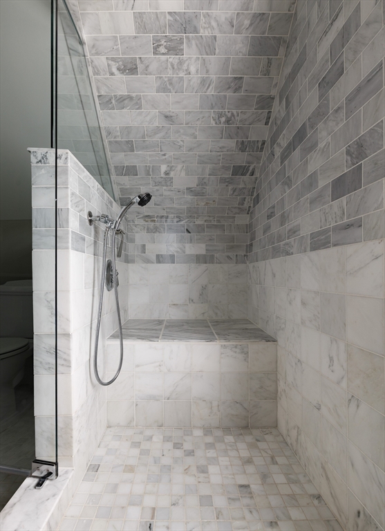 128 Thorndike Street, Unit 128 Arlington, MA 02474 - Photo 14 of 20 a bathroom with a shower