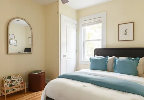 a bedroom with a bed and window