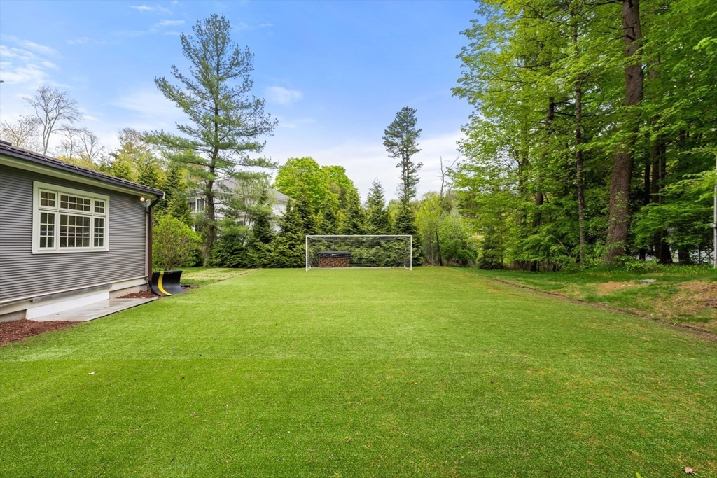 41 Longmeadow Road Wellesley, MA 02482 - Photo 34 of 41 a view of a backyard with a garden