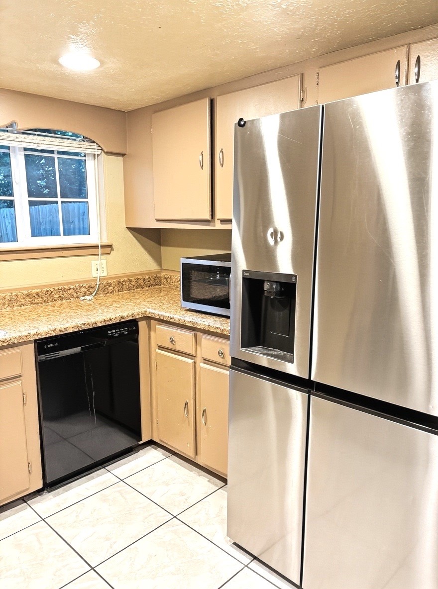 2514 Union Mill Road Houston, TX 77067 - Photo 17 of 25 a kitchen with stainless steel appliances granite countertop a refrigerator sink and cabinets