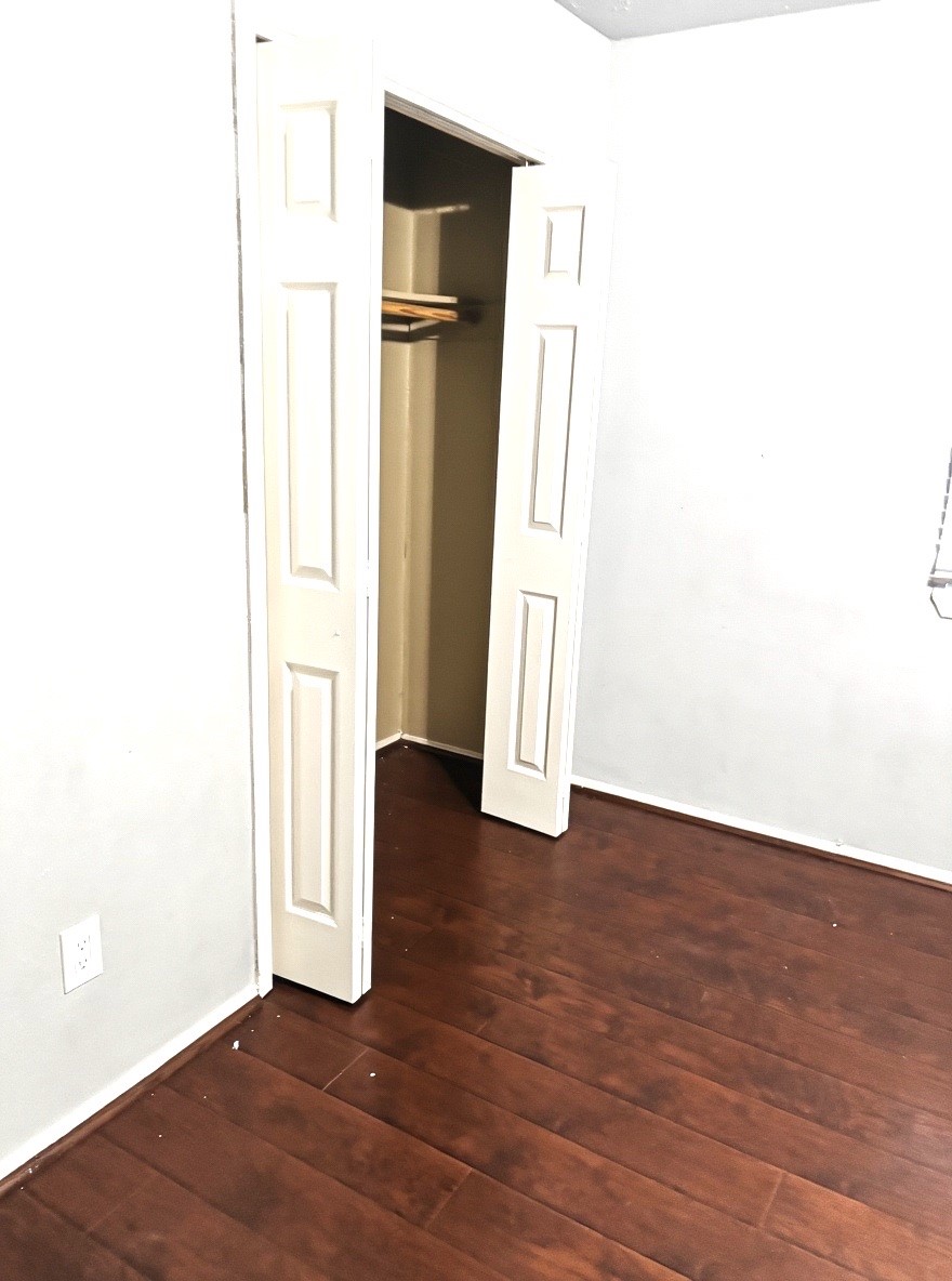 2514 Union Mill Road Houston, TX 77067 - Photo 3 of 25 a view of empty room with wooden floor