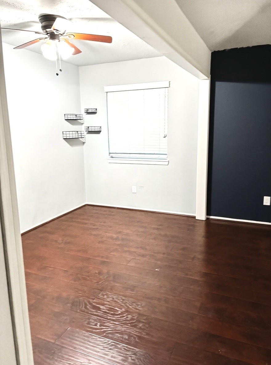 2514 Union Mill Road Houston, TX 77067 - Photo 10 of 25 a view of empty room with wooden floor
