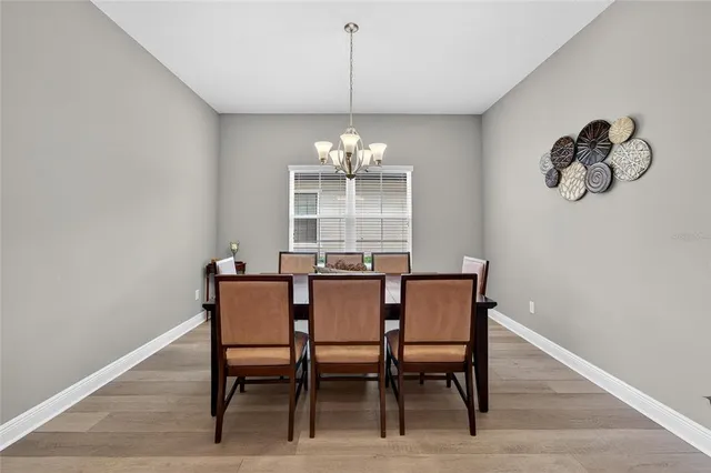 a kitchen with granite countertop stainless steel appliances and refrigerator