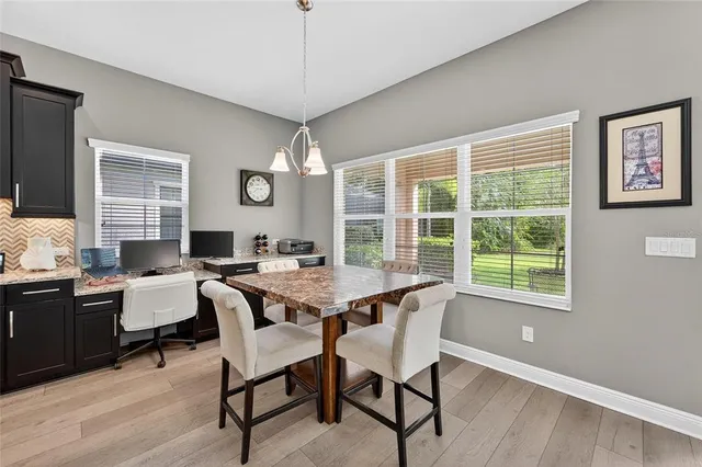 a bed room with a bed and a chair