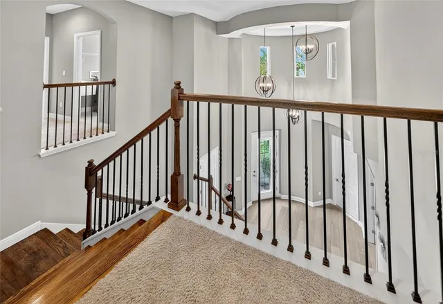 an aerial view of residential houses with outdoor space and lake view