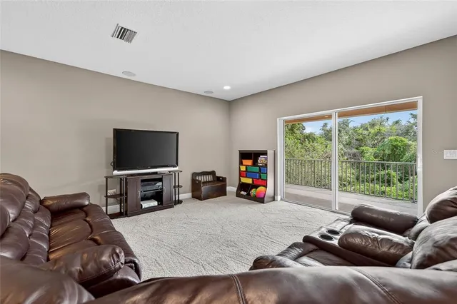 an aerial view of a house with garden space and street view