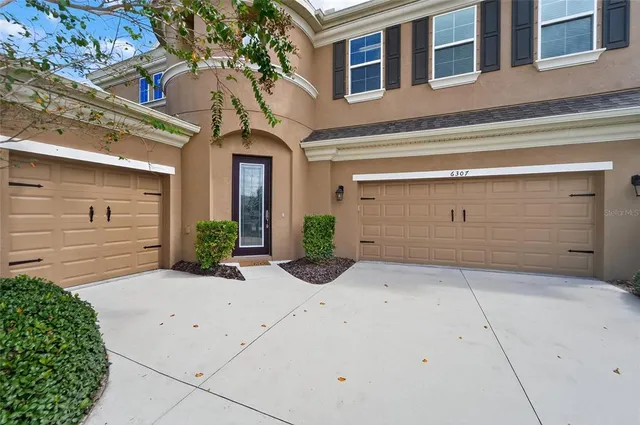 a view of a hallway view with wooden floor and staircase