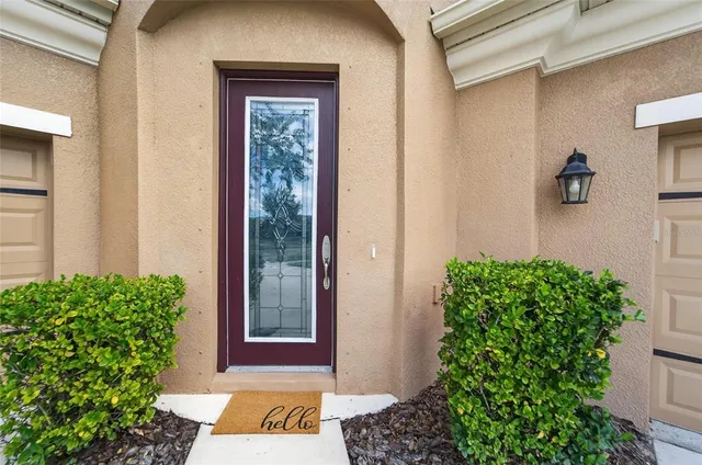 a living room with furniture a rug and a window