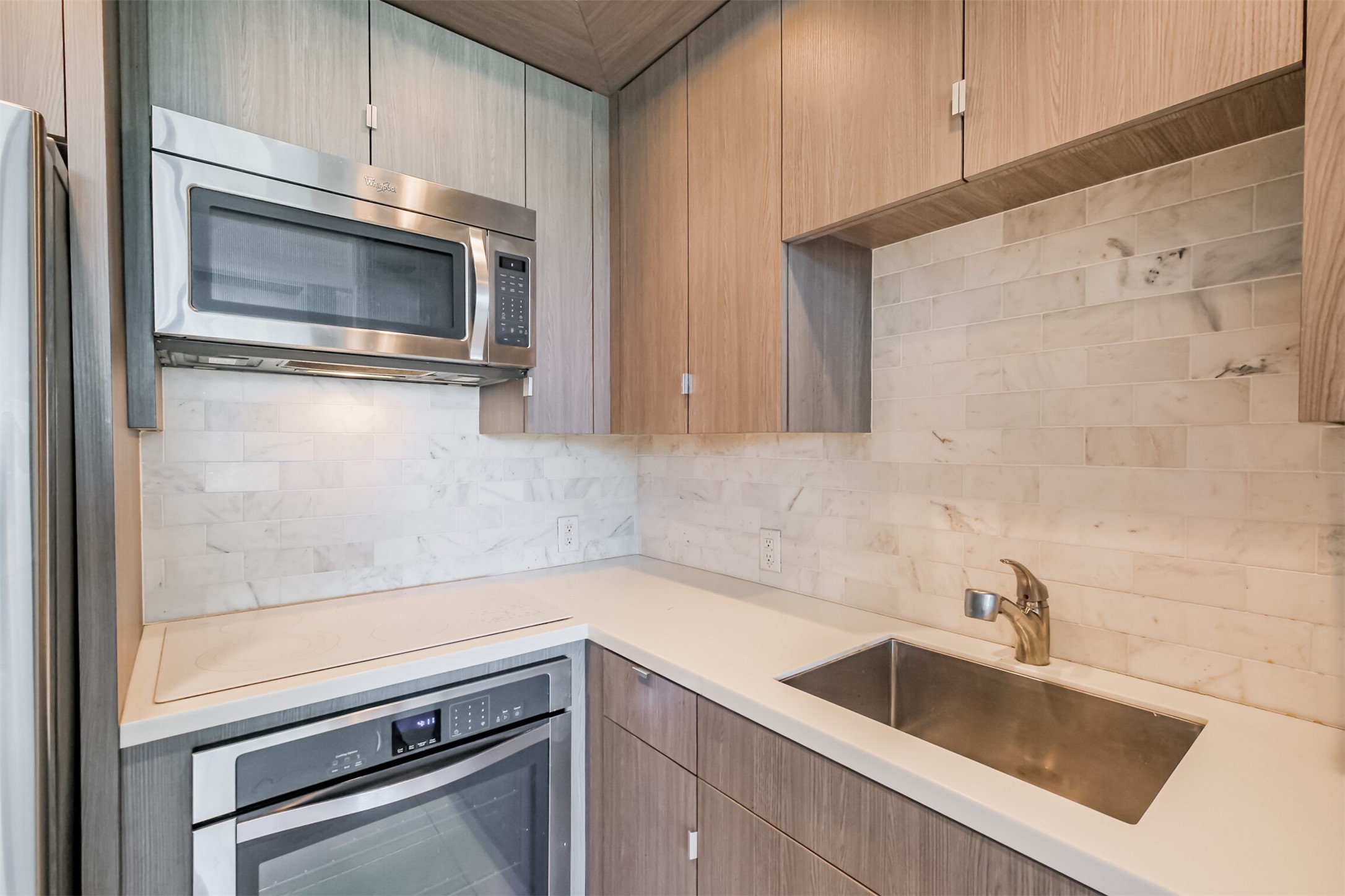 3600 Montrose Boulevard, Unit 104 Houston, TX 77006 - Photo 11 of 42 a kitchen with a sink and cabinets