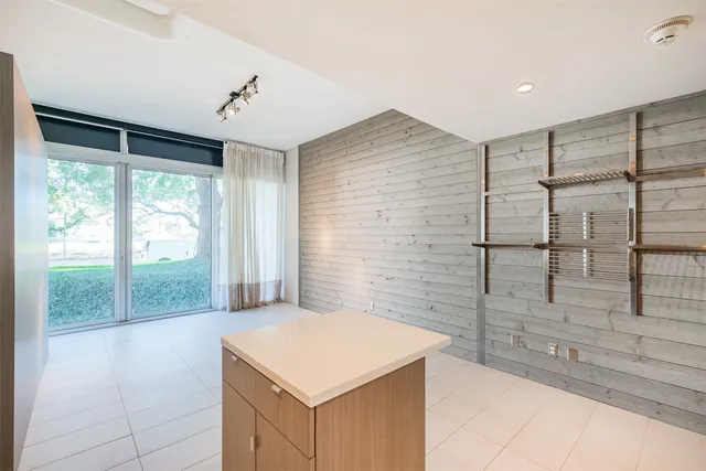 a bathroom with a tub and shower