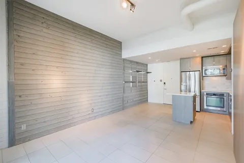 a view of livingroom with kitchen and furniture