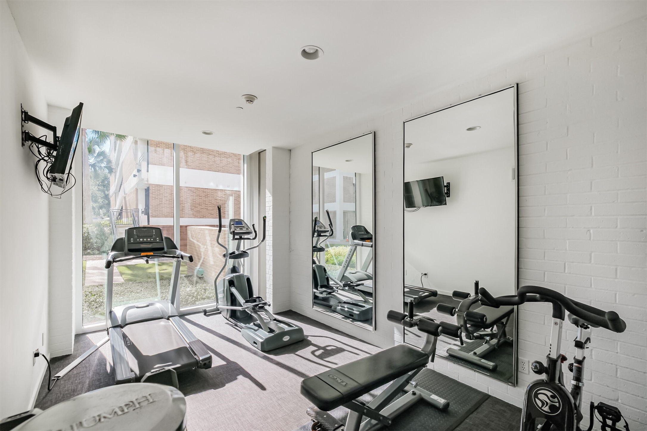 3600 Montrose Boulevard, Unit 104 Houston, TX 77006 - Photo 30 of 42 a view of a workspace with furniture and a window