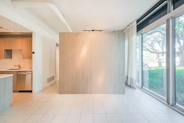 a view of a kitchen with a sink and a stove top oven