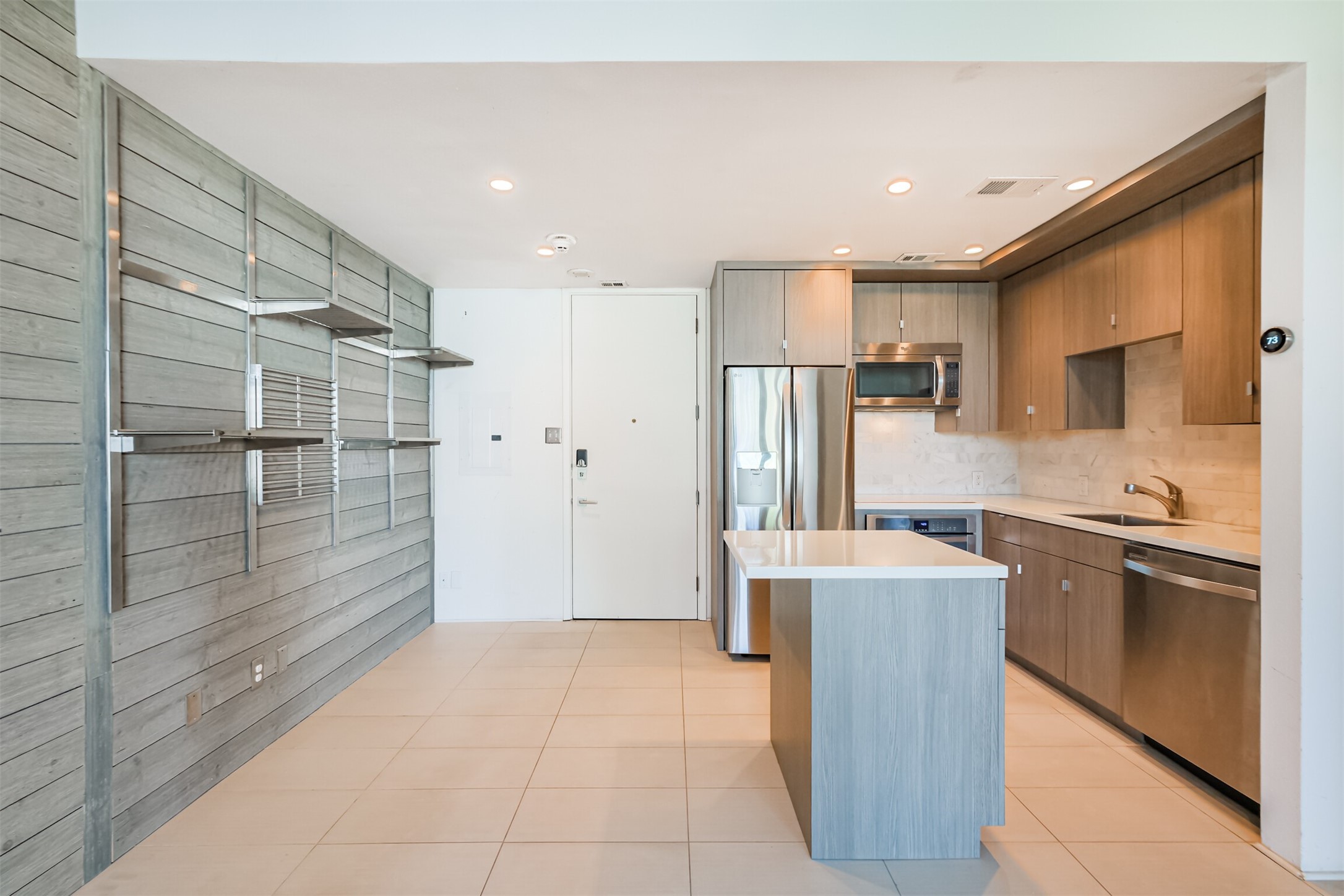 3600 Montrose Boulevard, Unit 104 Houston, TX 77006 - Photo 6 of 42 a kitchen with stainless steel appliances granite countertop a refrigerator and a sink