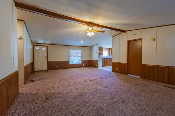 a view of a room with wooden walls