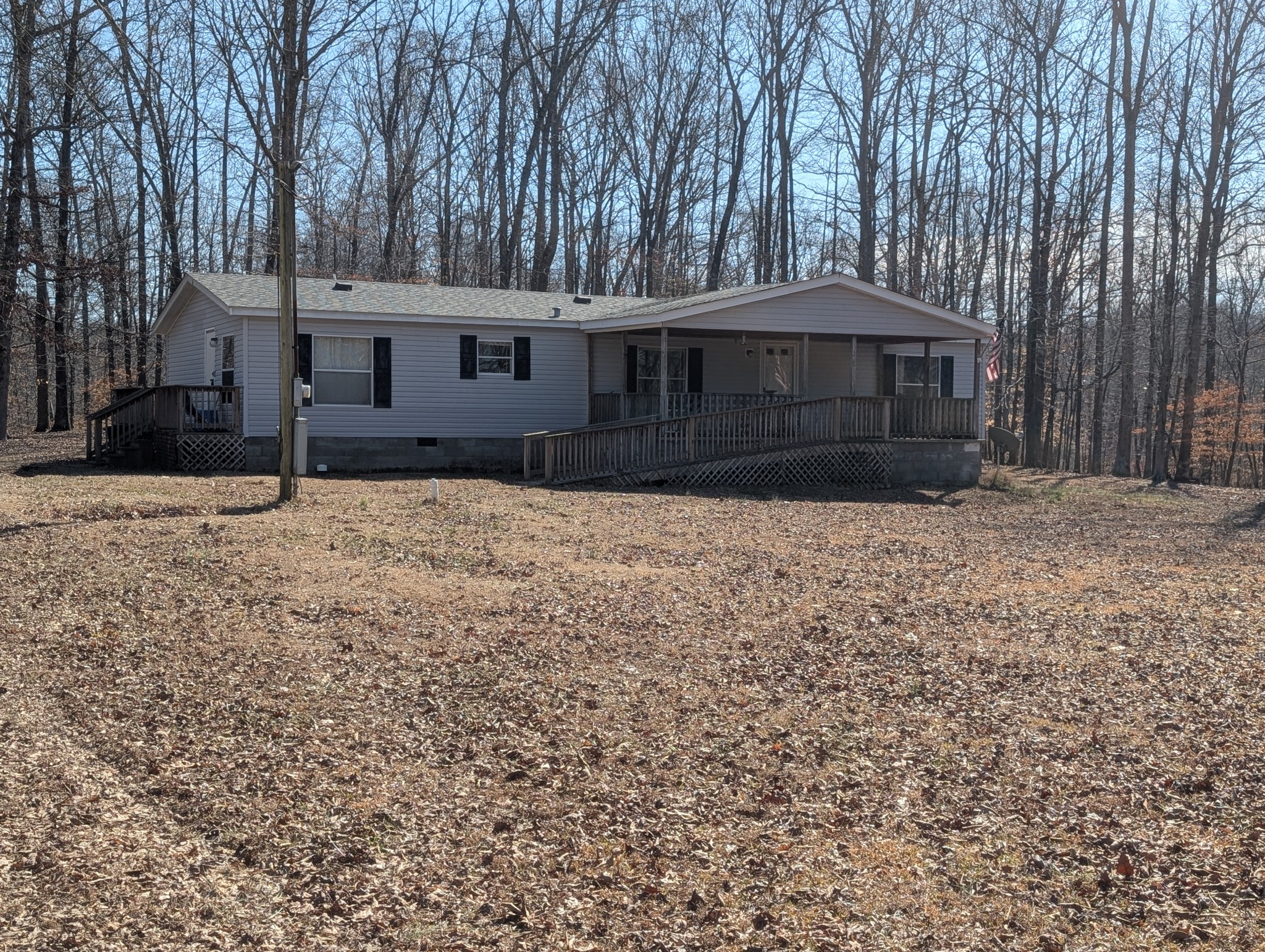 228 Shasteen Ridge Road Lynchburg, TN 37352 - Photo 5 of 12 a front view of a house with a yard