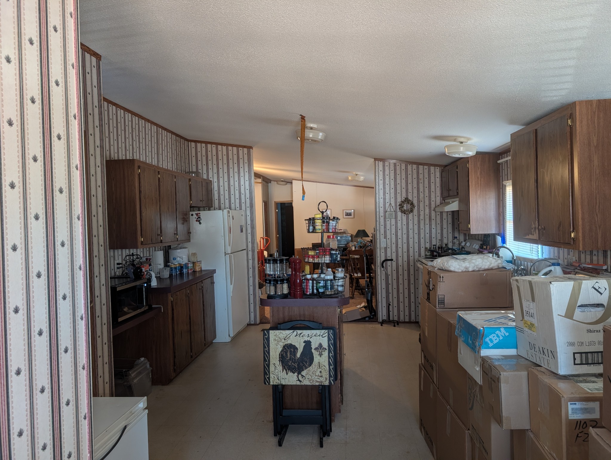228 Shasteen Ridge Road Lynchburg, TN 37352 - Photo 7 of 12 a living room with a couch and a refrigerator