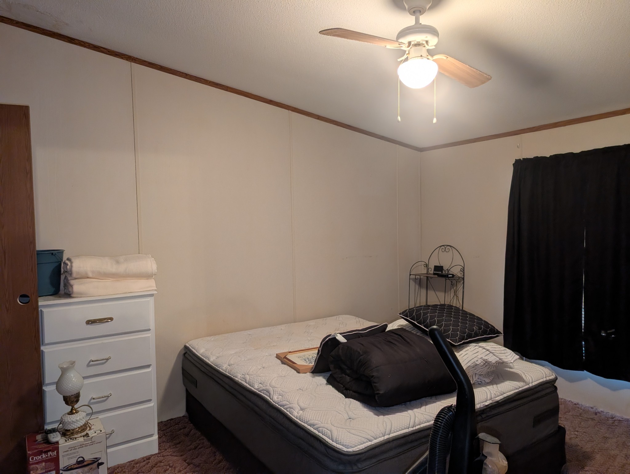 228 Shasteen Ridge Road Lynchburg, TN 37352 - Photo 9 of 12 a bedroom with a bed and a ceiling fan