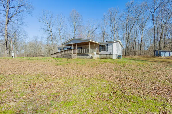 a swimming pool is sitting in the middle of a yard