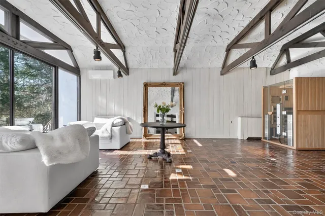 a kitchen with sink and white cabinets