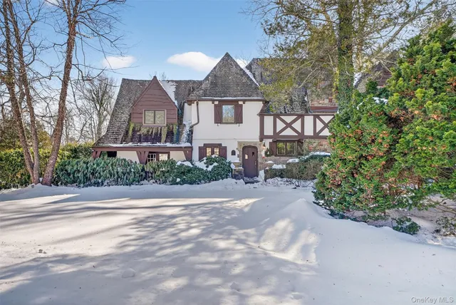 a living room with furniture a fireplace and a table