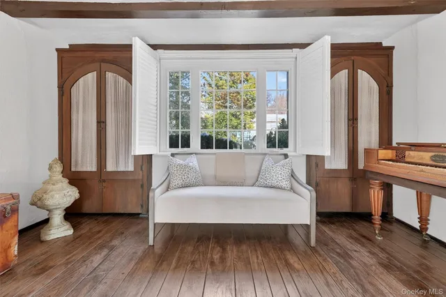 a view of a dining room with furniture window and wooden floor