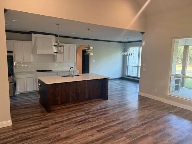 a spacious bathroom with a double vanity sink and a mirror