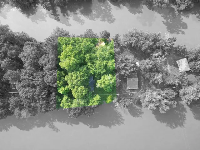 a backyard of a house with a yard and outdoor seating