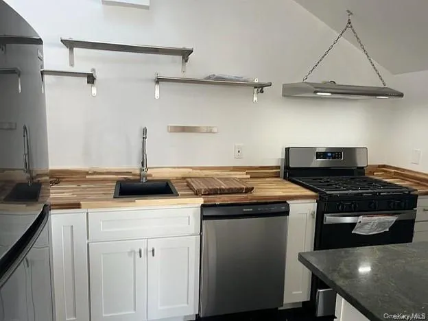 a kitchen with a stove and a sink