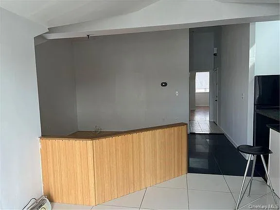 a view of a room with wooden floor and staircase