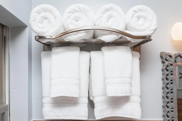 a living room with patio furniture and a floor to ceiling window