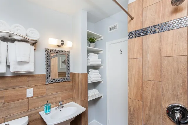a view of living room with furniture and wooden floor