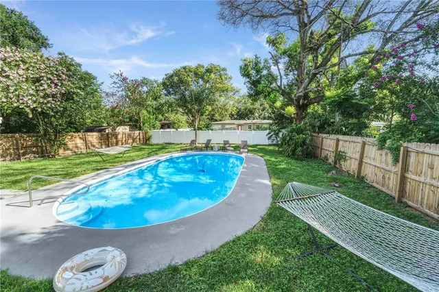 a front view of house with yard and garage