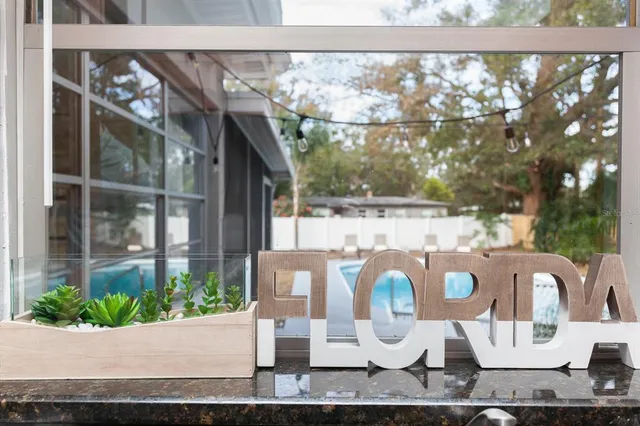 a view of a swimming pool with a yard