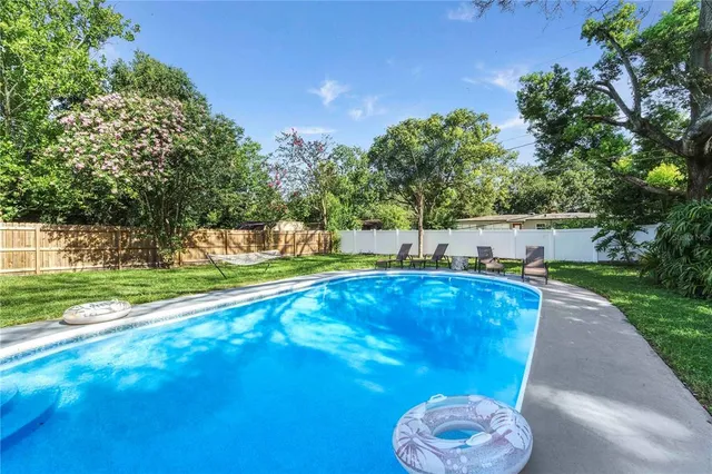 a view of a swimming pool with a patio