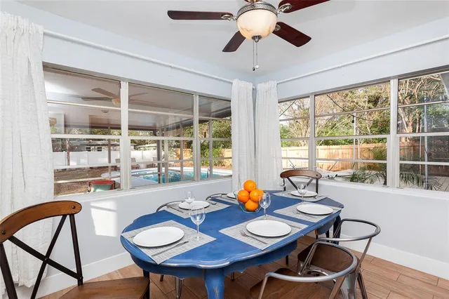 a view of a dining room with furniture window and wooden floor