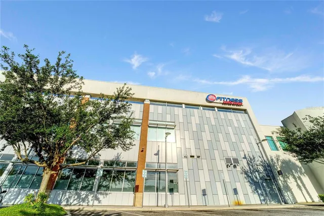 a view of building with sign board