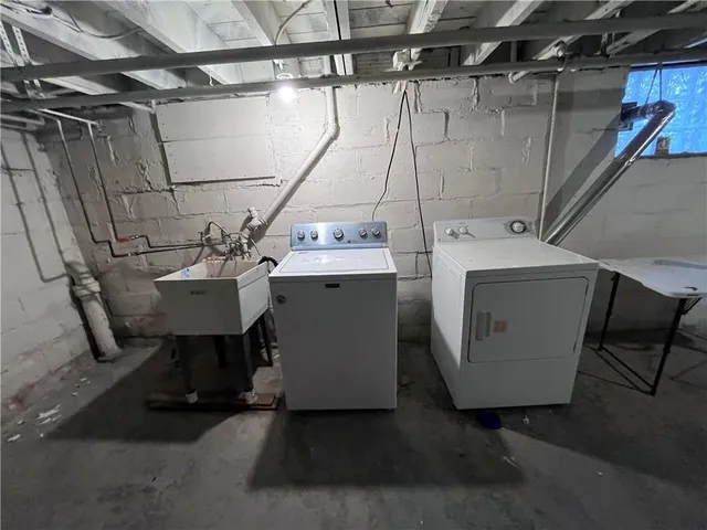 a utility room with dryer and washer