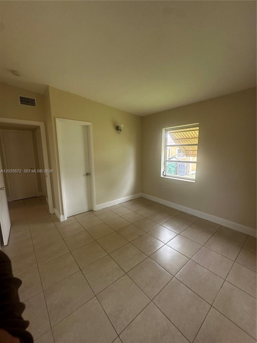 14475 Southwest 288th Street Homestead, FL 33033 - Photo 10 of 26 a view of empty room with windows