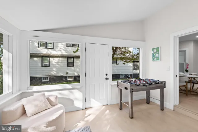 a bedroom with furniture and a window