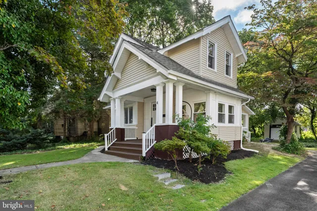 a front view of house with a garden