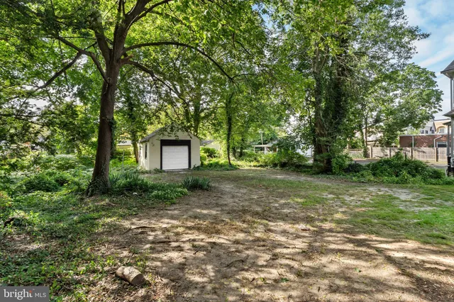 a view of a house with a tree