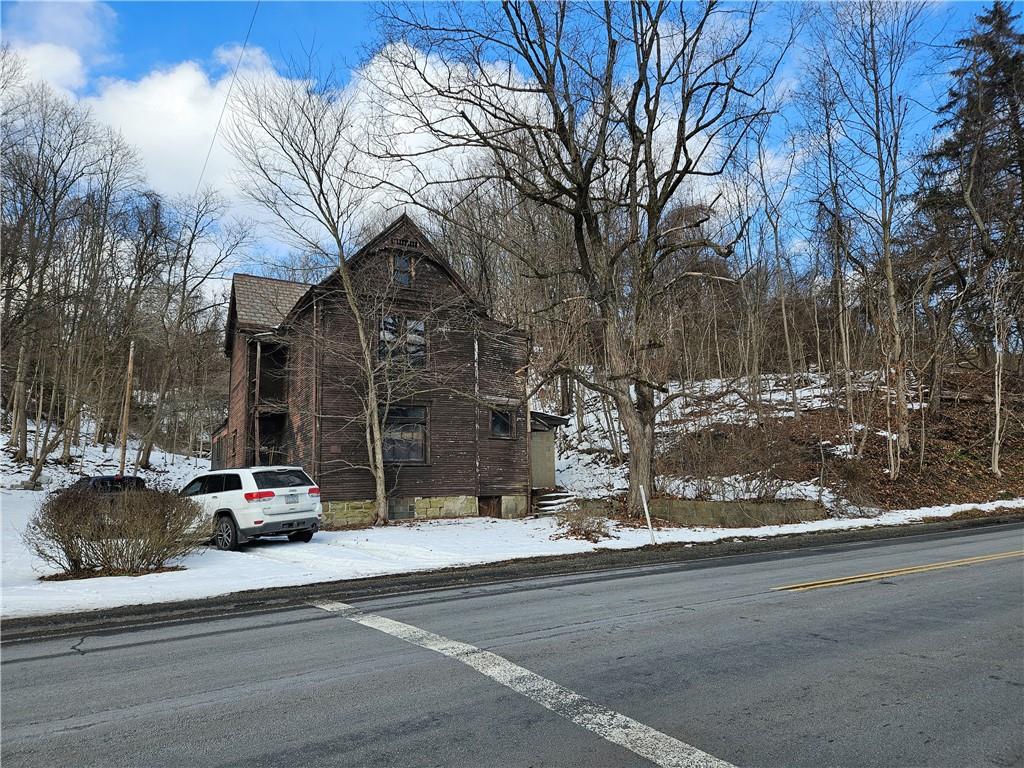 937 Larimer Avenue Turtle Creek, PA 15145 - Photo 2 of 17 a car parked on the side of a street