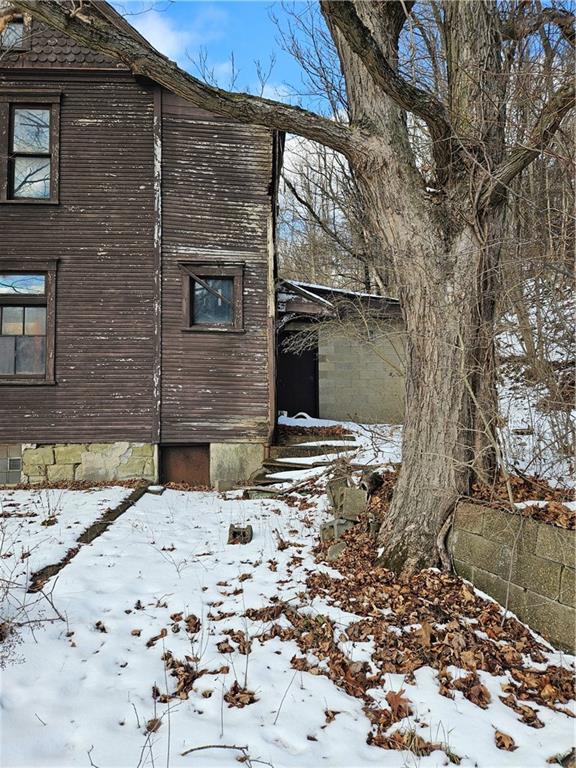 937 Larimer Avenue Turtle Creek, PA 15145 - Photo 6 of 17 a view of a backyard with a tree