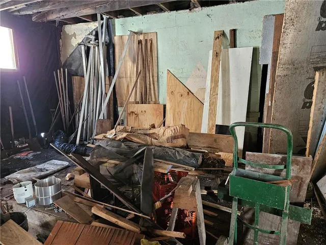 a view of a room with chairs and refrigerator
