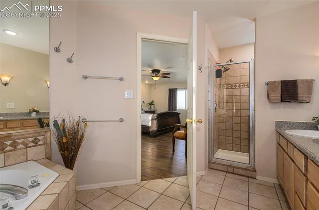 a bathroom with a shower and a sink