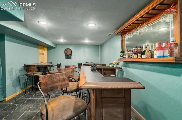 a dinning table and chairs in a room