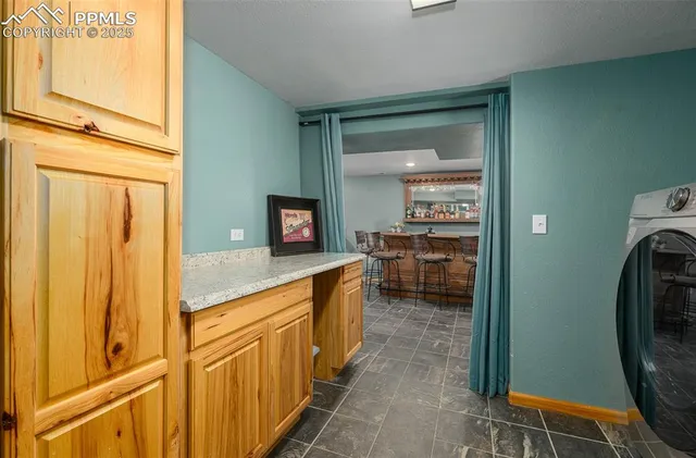 a en suite bathroom with a sink a mirror and a shower