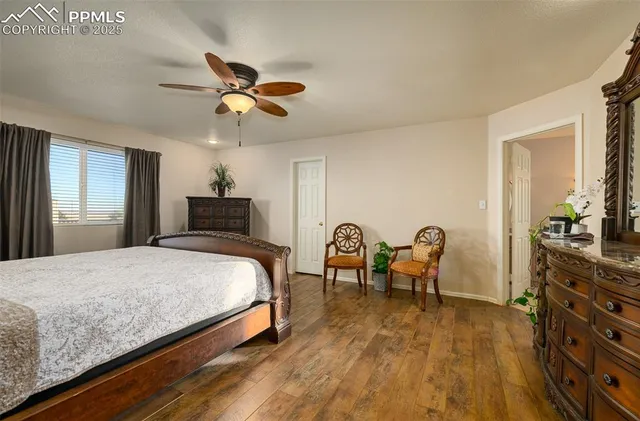 a bedroom with bed and window