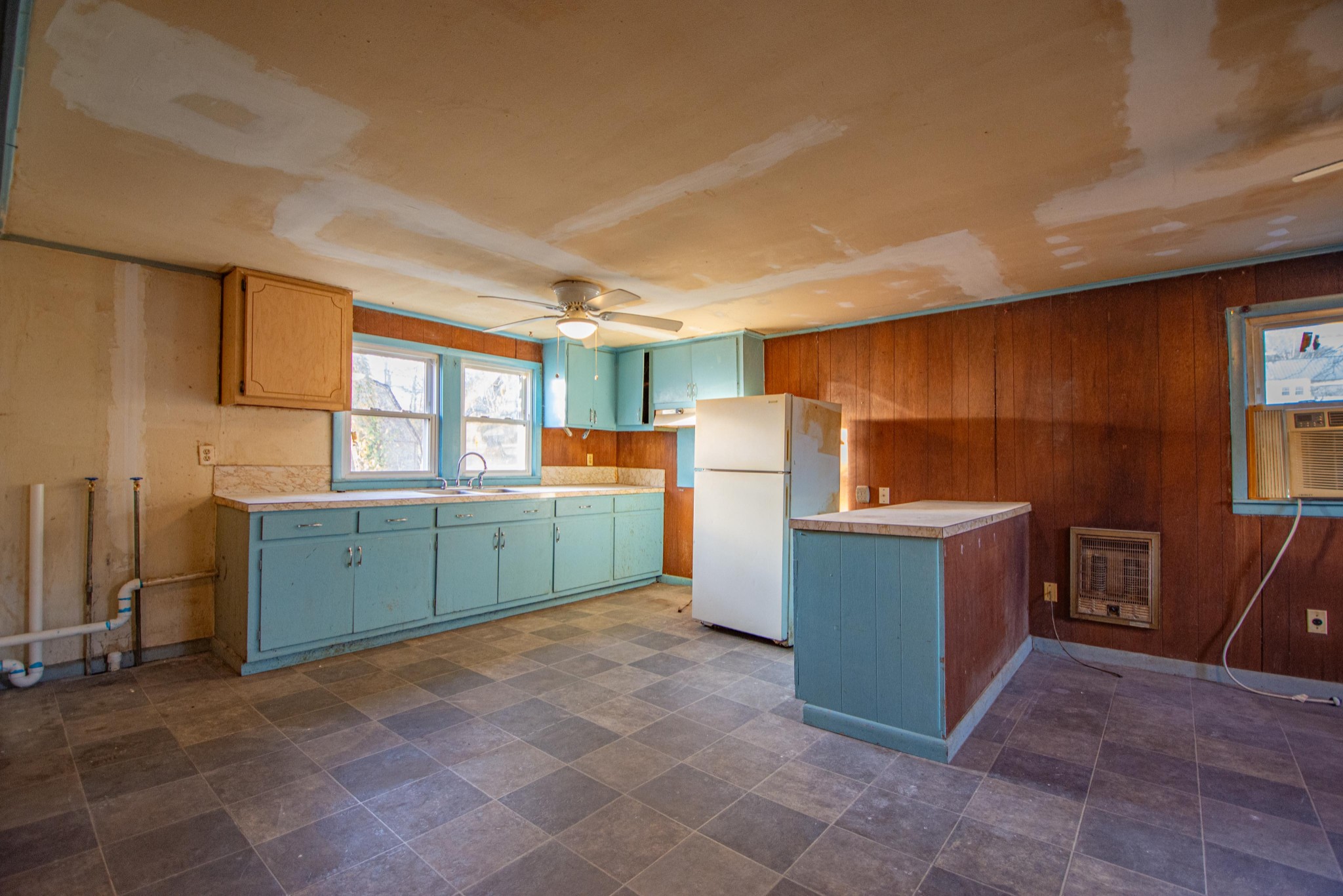 632 East Madison Street Pulaski, TN 38478 - Photo 14 of 22 a kitchen with window and cabinets